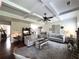 Bright living room featuring stylish decor, tray ceilings, and hardwood flooring at 4745 Belcrest Way, Cumming, GA 30040