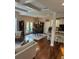 Open living and dining area with coffered ceilings and hardwood floors at 4745 Belcrest Way, Cumming, GA 30040