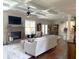 Spacious living area featuring a fireplace, coffered ceilings, and hardwood floors at 4745 Belcrest Way, Cumming, GA 30040