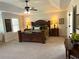 Spacious main bedroom with tray ceilings and elegant furnishings at 4745 Belcrest Way, Cumming, GA 30040