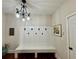 Inviting mudroom with coat hooks, bench, and decorative lighting at 4745 Belcrest Way, Cumming, GA 30040