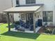 Inviting covered patio with comfortable seating and a grill for outdoor entertainment at 4745 Belcrest Way, Cumming, GA 30040