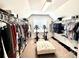 Spacious walk-in closet features ample storage with room for workout equipment at 4745 Belcrest Way, Cumming, GA 30040