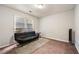 Simple bedroom with plush carpet, a large window, and a cozy futon for guests at 1328 Hidden Hills Pkwy, Stone Mountain, GA 30088