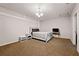 Bedroom with neutral carpet and decor, with a queen bed and a bedside table at 1328 Hidden Hills Pkwy, Stone Mountain, GA 30088