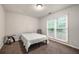 Bedroom featuring large windows, neutral walls, carpet and simple furnishings at 1328 Hidden Hills Pkwy, Stone Mountain, GA 30088