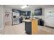 Modern kitchen with stainless steel appliances, granite countertops, and a kitchen island at 1328 Hidden Hills Pkwy, Stone Mountain, GA 30088