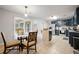 Spacious kitchen with a dining table, stainless steel appliances, and plenty of counter space at 1328 Hidden Hills Pkwy, Stone Mountain, GA 30088
