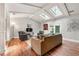 Comfortable living room with vaulted ceilings, skylights, hardwood floors and modern furnishings at 1328 Hidden Hills Pkwy, Stone Mountain, GA 30088