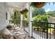 Inviting balcony with outdoor seating and lush greenery, perfect for relaxation at 300 Brickworks Ne Cir # 302, Atlanta, GA 30307