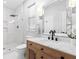 Bright bathroom featuring a walk-in shower, white vanity, and modern fixtures at 300 Brickworks Ne Cir # 302, Atlanta, GA 30307