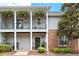 Charming two-story condo with covered patios and hanging plants at 300 Brickworks Ne Cir # 302, Atlanta, GA 30307