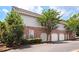 Well-maintained condo complex with brick accents, garages, and mature trees at 300 Brickworks Ne Cir # 302, Atlanta, GA 30307
