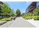 Outdoor shot of the greenway with retail shops and modern apartments, featuring bike and scooter parking at 300 Brickworks Ne Cir # 302, Atlanta, GA 30307
