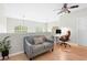 Versatile loft area with a cozy couch, desk, and bright windows for a productive workspace at 300 Brickworks Ne Cir # 302, Atlanta, GA 30307