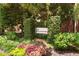 Welcoming signage for The Brickworks community surrounded by greenery and flowers at 300 Brickworks Ne Cir # 302, Atlanta, GA 30307