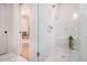 Modern glass shower with bench, with white tile, stylish fixtures and mosaic tiled floors at 50 Howell Se St # A, Atlanta, GA 30312