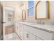 Beautiful bathroom boasting marble counters, double sinks, ample natural light, and modern fixtures at 50 Howell Se St # A, Atlanta, GA 30312