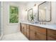 Elegant bathroom featuring double vanity with marble countertop and modern fixtures at 50 Howell Se St # A, Atlanta, GA 30312