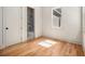 Bright bedroom with hardwood floors and natural light, showcasing an ensuite bathroom at 50 Howell Se St # A, Atlanta, GA 30312