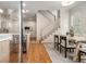 Inviting dining area with hardwood floors, a modern table, and staircase access at 50 Howell Se St # A, Atlanta, GA 30312