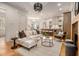Open concept living room featuring hardwood floors, modern furnishings, and a view into the kitchen at 50 Howell Se St # A, Atlanta, GA 30312