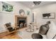 Bright living room featuring a decorative fireplace, modern lighting, and stylish furnishings at 50 Howell Se St # A, Atlanta, GA 30312