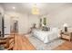 Relaxing main bedroom with decorative wall trim, a plush bed, and warm natural light at 50 Howell Se St # A, Atlanta, GA 30312