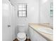 Bright bathroom with a window, toilet, sink and shower at 830 The Cir, Lawrenceville, GA 30043