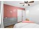 Charming bedroom with wall decor and modern dresser at 830 The Cir, Lawrenceville, GA 30043
