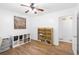 Spacious bedroom featuring laminate flooring, ample storage options, and neutral decor, creating a versatile space at 830 The Cir, Lawrenceville, GA 30043
