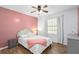 Cozy bedroom featuring a comfortable bed and ceiling fan at 830 The Cir, Lawrenceville, GA 30043