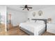 Bedroom featuring wall decor, closet, and wood floors at 830 The Cir, Lawrenceville, GA 30043