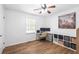 Well-lit bedroom with laminate flooring and modern storage solutions, ideal for a home office or study at 830 The Cir, Lawrenceville, GA 30043
