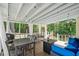 Relaxing covered deck with outdoor seating, grill, and stylish decor for enjoyable outdoor living at 830 The Cir, Lawrenceville, GA 30043