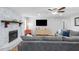 Spacious living room with stone fireplace and hardwood floors, creating a cozy atmosphere at 830 The Cir, Lawrenceville, GA 30043