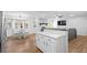 Inviting living space showcases an open floor plan connecting kitchen, dining, and living areas, perfect for entertaining at 830 The Cir, Lawrenceville, GA 30043