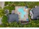 Overhead view of community pool with ample lounge seating, surrounded by mature trees at 9 Saint Claire Ne Ln, Atlanta, GA 30324