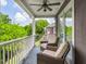 Covered balcony with comfortable seating, white railings, and a leafy view at 9 Saint Claire Ne Ln, Atlanta, GA 30324