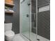 Modern bathroom featuring stylish herringbone tile in the glass-enclosed shower and a built-in niche at 9 Saint Claire Ne Ln, Atlanta, GA 30324