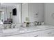 Bright bathroom featuring a marble countertop with double sinks and modern faucets at 9 Saint Claire Ne Ln, Atlanta, GA 30324