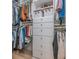 Organized walk-in closet with built-in shelving, drawers, and ample hanging space at 9 Saint Claire Ne Ln, Atlanta, GA 30324