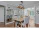 Bright dining room featuring a decorative mirror, wood floors, and a chandelier, perfect for Gathering meals at 9 Saint Claire Ne Ln, Atlanta, GA 30324