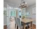 Dining room with modern chandelier, views to office, and bright, natural light at 9 Saint Claire Ne Ln, Atlanta, GA 30324