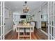 Open-concept dining room with hardwood floors connecting to living room, plenty of natural light at 9 Saint Claire Ne Ln, Atlanta, GA 30324