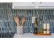 Close up of kitchen counter featuring blue backsplash tiles and cooking essentials at 9 Saint Claire Ne Ln, Atlanta, GA 30324