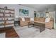 Open-concept living room with a large sectional sofa, stylish decor, and hardwood floors at 9 Saint Claire Ne Ln, Atlanta, GA 30324
