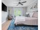 Comfortable main bedroom featuring a balcony, soft natural light, and a relaxing ambiance at 9 Saint Claire Ne Ln, Atlanta, GA 30324