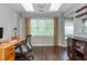 Well-lit home office with hardwood floors, providing a comfortable and productive workspace at 9 Saint Claire Ne Ln, Atlanta, GA 30324