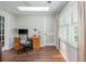 Inviting home office features hardwood floors, natural light, and a serene atmosphere for focused work at 9 Saint Claire Ne Ln, Atlanta, GA 30324